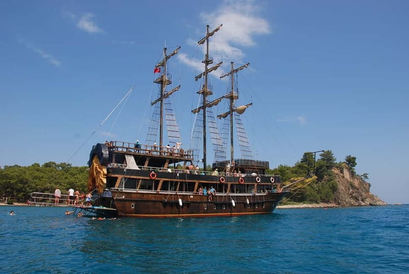 Alanya: Pirate Boat Trip with Meal, Drinks and Pickup Option - The first swim stop sets the tone
