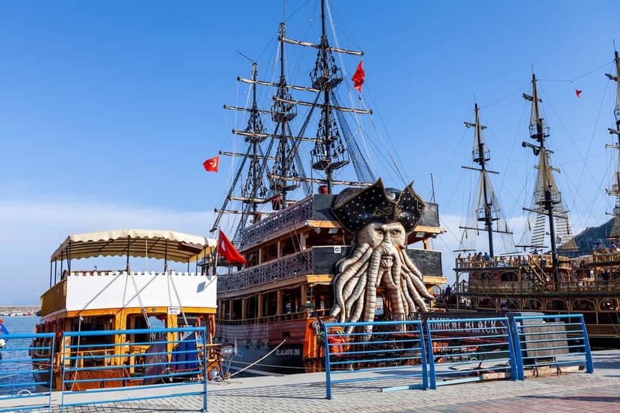 Alanya: Pirate Boat with Transfer, Lunch & Unlimited Drinks - Red Tower, shipyard, and castle views