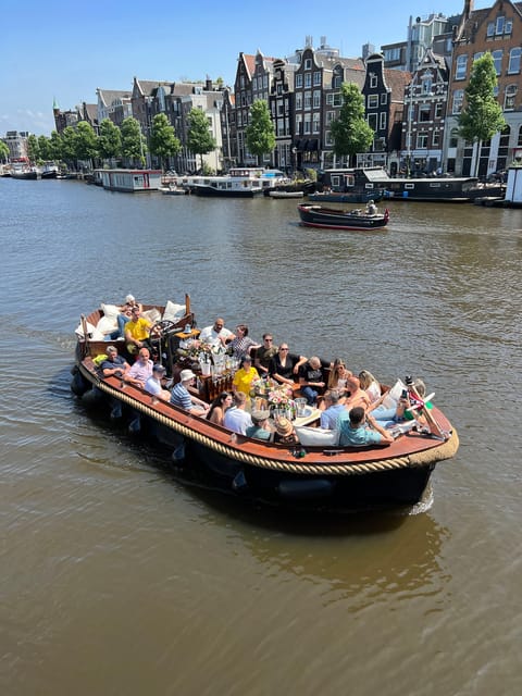 Amsterdam: Boat Tour with Optional Unlimited Drinks - De L’Europe, Munttoren, and the return loop