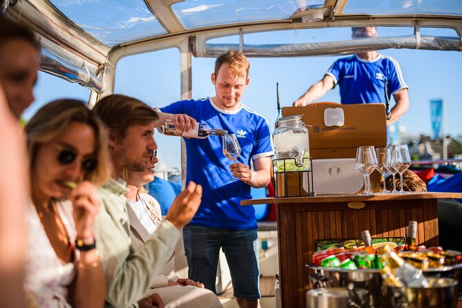 Amsterdam: Canal Booze Cruise with Unlimited Drinks Option - The 7 Bridges canal and De Wallen