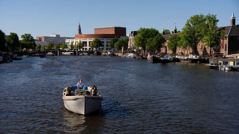 Amsterdam: Canal Cruise in Open Boat with Drink Option - Theater Carré, Magere Brug, and the eastern canal views
