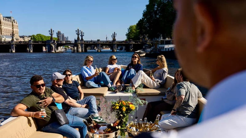 Amsterdam: Canal Cruise in Open Boat with Drink Option - Choosing between Central Station and the Anne Frank House