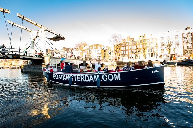 Amsterdam Canal Cruise With Live Guide and Unlimited Drinks - Jordaan, Westerkerk, and houseboat views