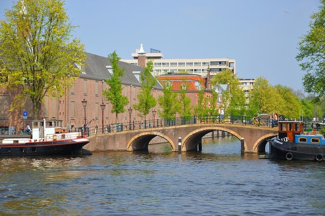 Amsterdam Classic Saloon Boat Cruise with Drinks and Cheese - A low view of Amsterdam’s canal ring