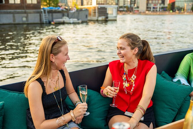 Amsterdam: Guided Open Boat Canal Cruise Unlimited Drinks Option - Theater, markets, and the Amstel