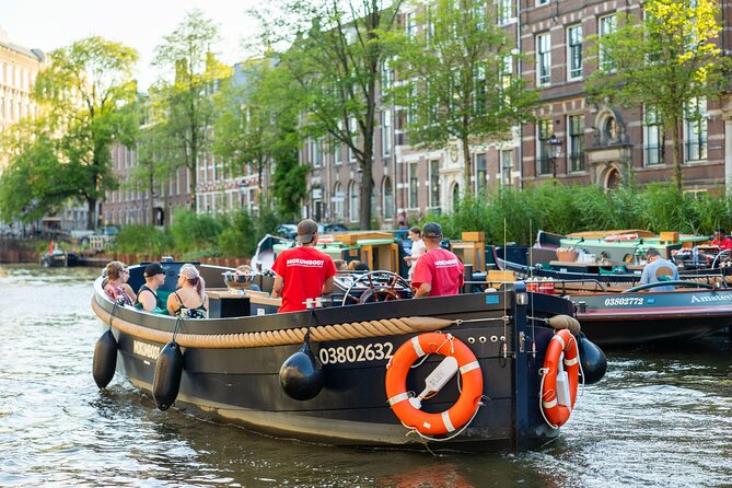 Amsterdam: Guided Open Boat Canal Cruise Unlimited Drinks Option - Seven bridges and the city’s best canal view