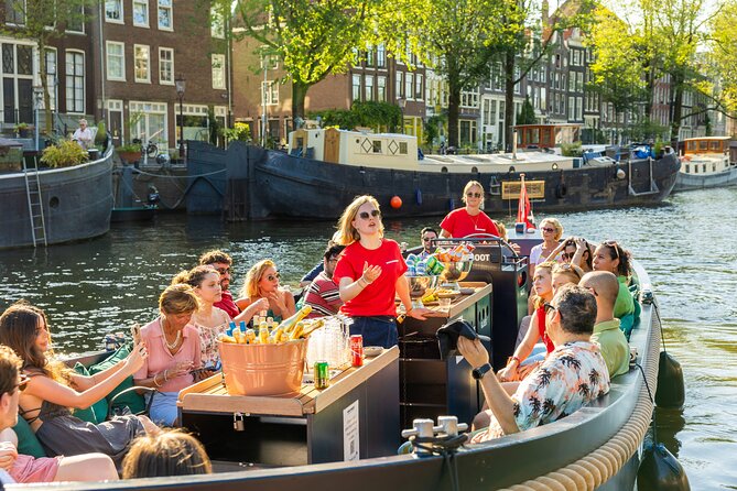 Amsterdam: Guided Open Boat Canal Cruise Unlimited Drinks Option - Towers, pubs, diamonds, and Jewish Amsterdam