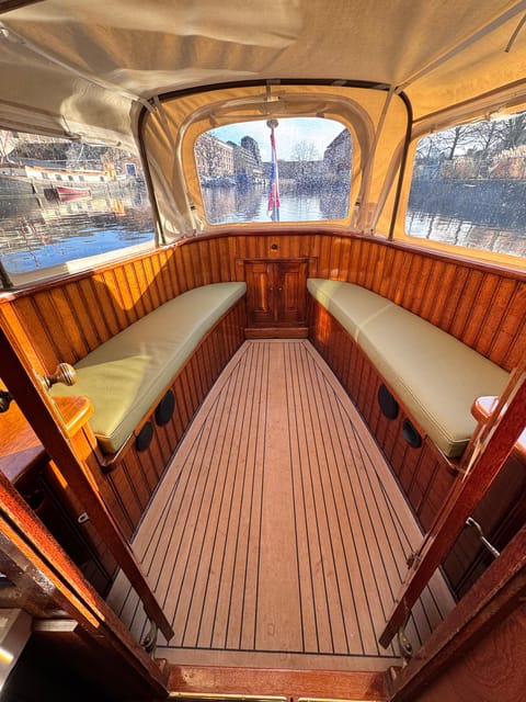 Amsterdam: Historic Boat Cruise with open bar and nibbles - Timing, weather, and booking flexibility