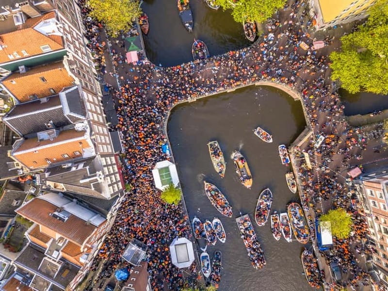 Amsterdam: Kings Day Boat Party with Unlimited Drinks - A 90-minute route through Amsterdam’s canals