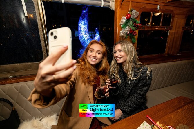 Amsterdam Light Festival: Heated Boat Cruise + Hot Drinks & Bite - Seeing Amsterdam Light Festival from the canals