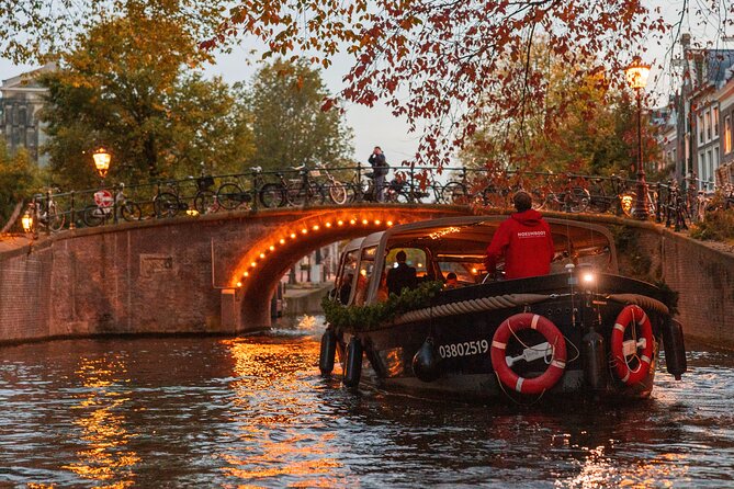 Amsterdam: Light Festival Open Boat - Unl. Drinks Option - The Strange Clock at Montelbaanstoren