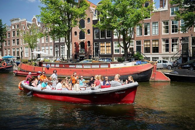 Amsterdam Light Festival: Saloon Boat Cruise + Hot Drinks & Bite - Seeing the Amsterdam Light Festival from the canal