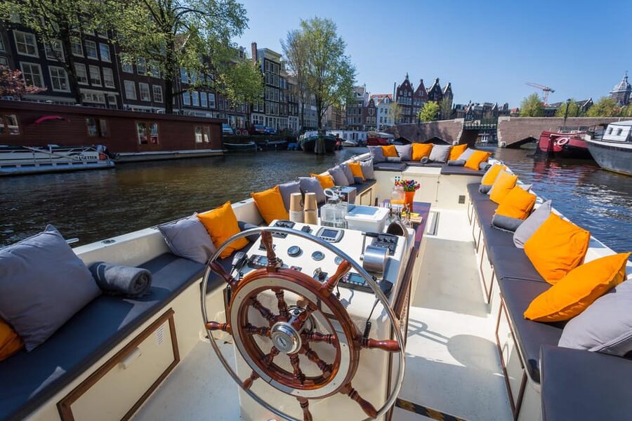 Amsterdam: Private Canal Cruise in German + Unlimited Drinks - Maritime Museum and the city’s seafaring past