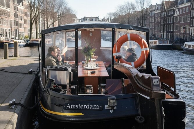 Amsterdam Smoke Friendly Cruise with drinks option & local guide - Amsterdam Central Station from the water