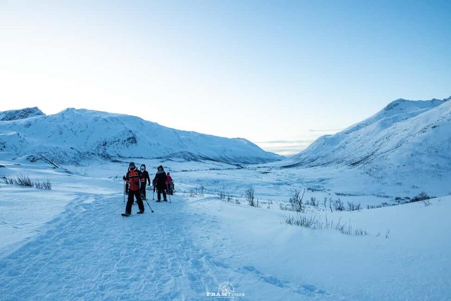 Arctic hike on Kvaløya Island with drinks and snacks - Putting on snowshoes for the first time