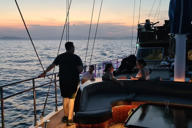 Athens Riviera Sunset Cruise with Snacks and Drinks Included - Watching the sun go down, then returning by night