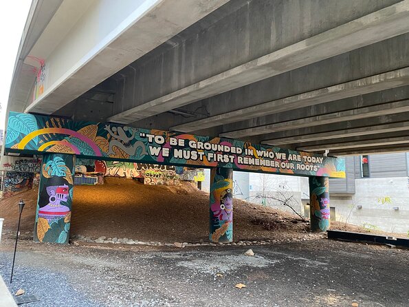 Atlanta Street Art and BeltLine Tour with Happy Hour and Activity - Krog Street Tunnel explains graffiti as a living record