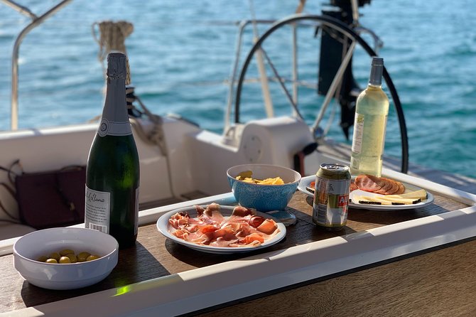 Barcelona Sailing: Light Snacks & Open Bar with Private Option - Drinks, tapas, and the social side