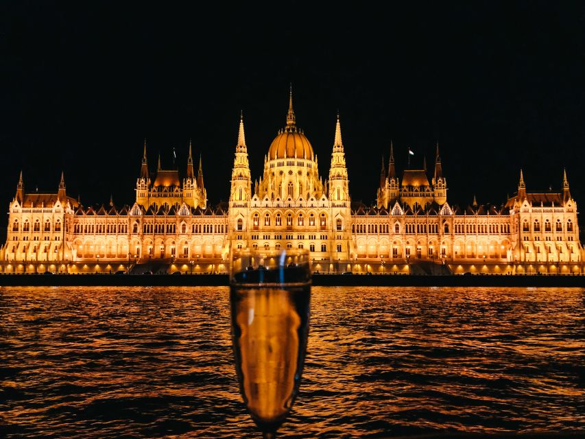 Budapest: 1-Hour Evening Sightseeing Cruise with Drink - Buda Castle glowing above the river