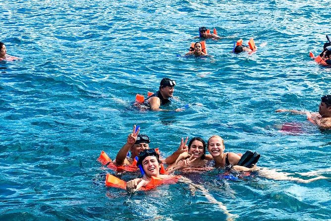 Cancun All Inclusive Catamaran Tour to Isla Mujeres - Sailing south with drinks and music