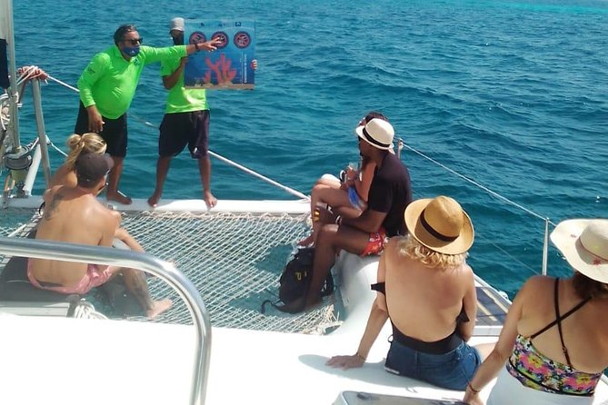 Catamaran to Isla Mujeres, Open bar, buffet, Beach Club Included - The first hour: music, drinks, and open water