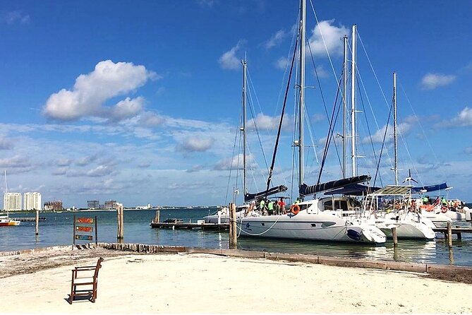 Catamaran to Isla Mujeres, Open bar, buffet, Beach Club Included - Reef snorkeling with a full shared boat