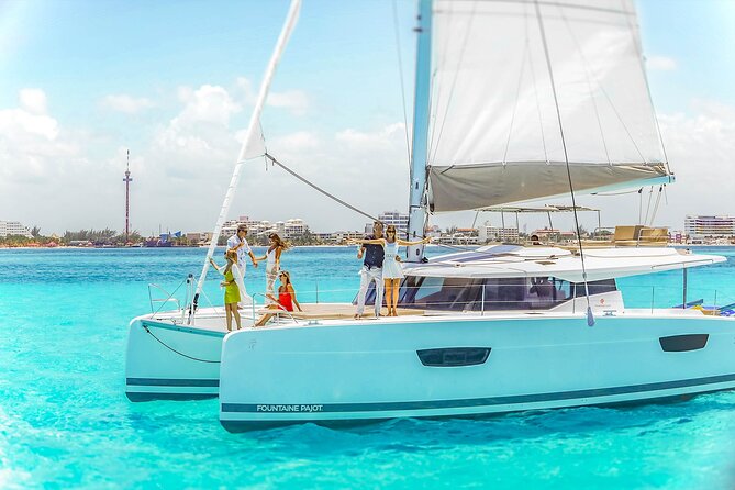 Catamaran to Isla Mujeres Snorkeling Tour with Open Bar and Lunch - Beach-club time, lunch, and the late-afternoon schedule