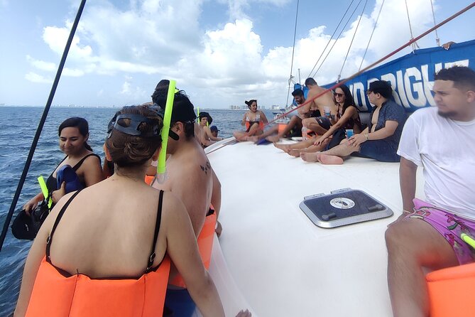 Deluxe Catamaran to Isla Mujeres, with Drinks, Snorkel & Buffet - Sailing toward Isla Mujeres with an open bar