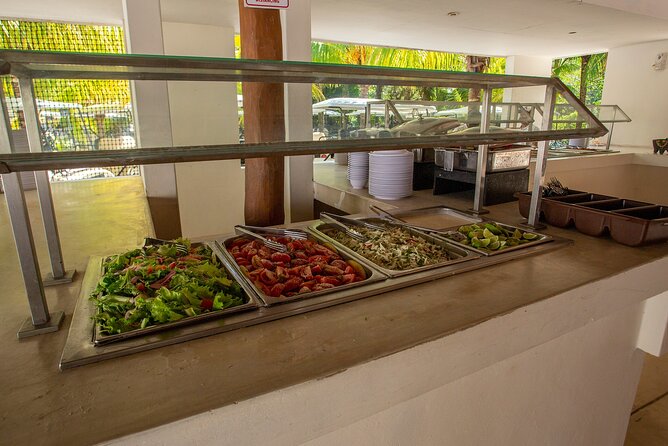 Deluxe Catamaran tour to Isla Mujeres with Open Bar and Lunch - Lunch and beach time at Albatros Beach Club
