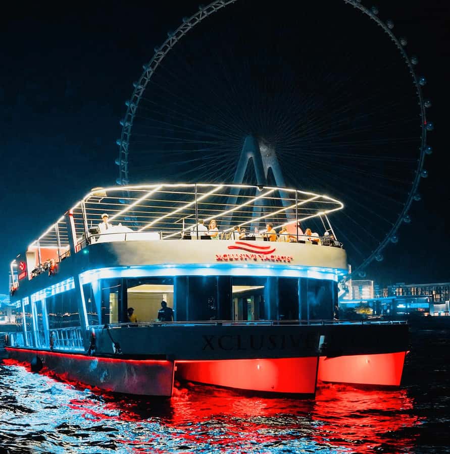 Dubai: Sunset or Dinner Cruise with Live Music & Open Bar - Boarding the Glass-Enclosed Yacht