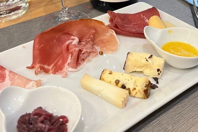 Florence Food Tour with Truffle Pasta, Steak & Free Flowing Wine - The opening spread: Parma ham, Pata Negra, and aged balsamic