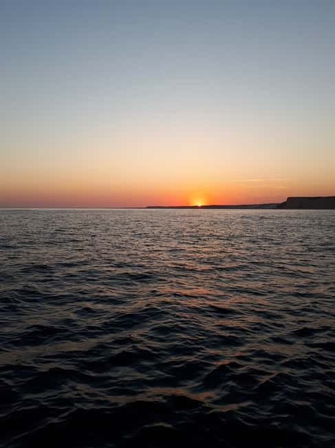 From Lagos: Ponta da Piedade Sunset Cruise with Drink - Seeing caves, beaches, and cliffs from the water