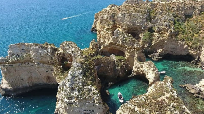 From Lagos: Ponta da Piedade Sunset Cruise with Drink - Leaving Lagos Harbor on a traditional boat