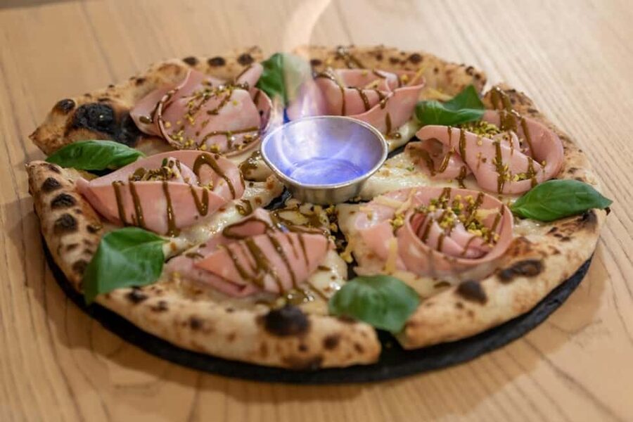 Gourmet Pizza Experience with Drinks and Dessert in Lecce - Four pizza slices, several toppings, and plenty to eat