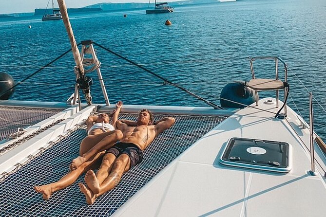 Half-Day Exclusive Catamaran Cruise in Santorini with Meal and Open Bar - Pickup from your hotel and the ride to Vlychada