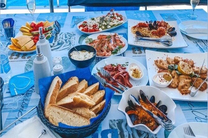 Half-Day Exclusive Catamaran Cruise in Santorini with Meal and Open Bar - The return sail past Fira and the Black Mountain