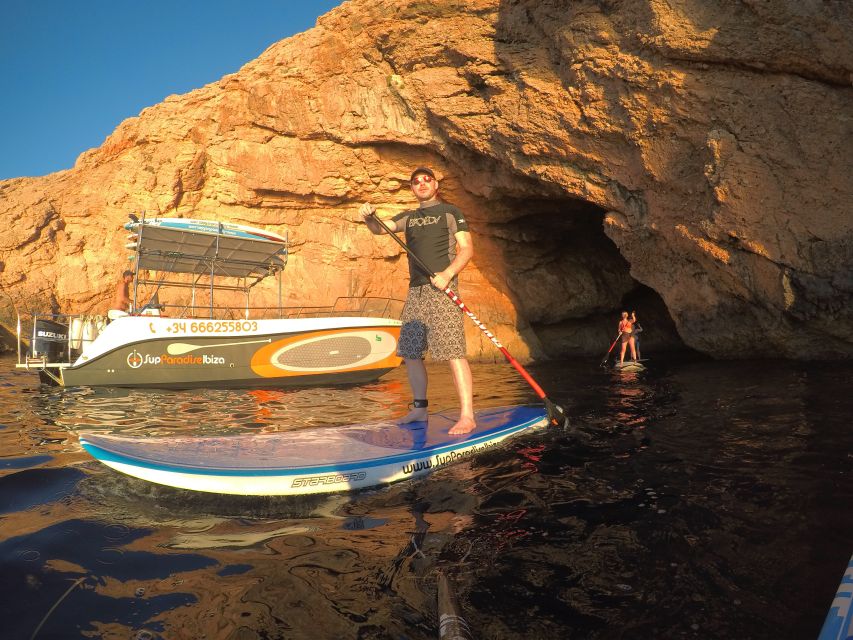 Ibiza: SUP & Snorkel Boat Tour with Caves, Drinks & Photos - Paddling through coves and sea caves