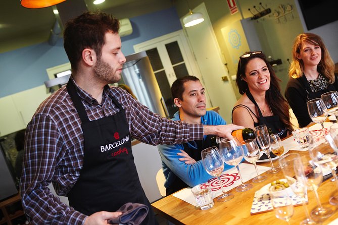 Interactive Paella & Market: Bottomless Wine & Rambla Views - Returning to the air-conditioned kitchen