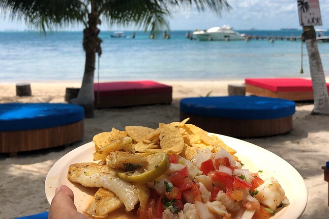 Isla Mujeres Catamaran Tour with Snorkeling at MUSA, Buffet Lunch & Open Bar - Isla Mujeres: lunch, shops, and a famous beach