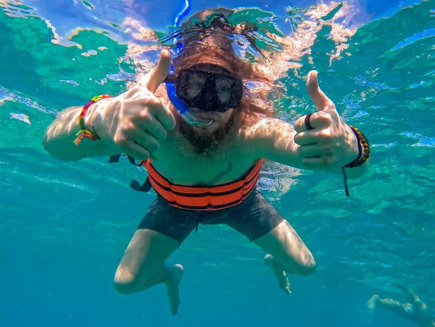Isla Mujeres Catamaran Tour with Snorkeling & Open bar - The return ride, open bar, and possible spinaker flight