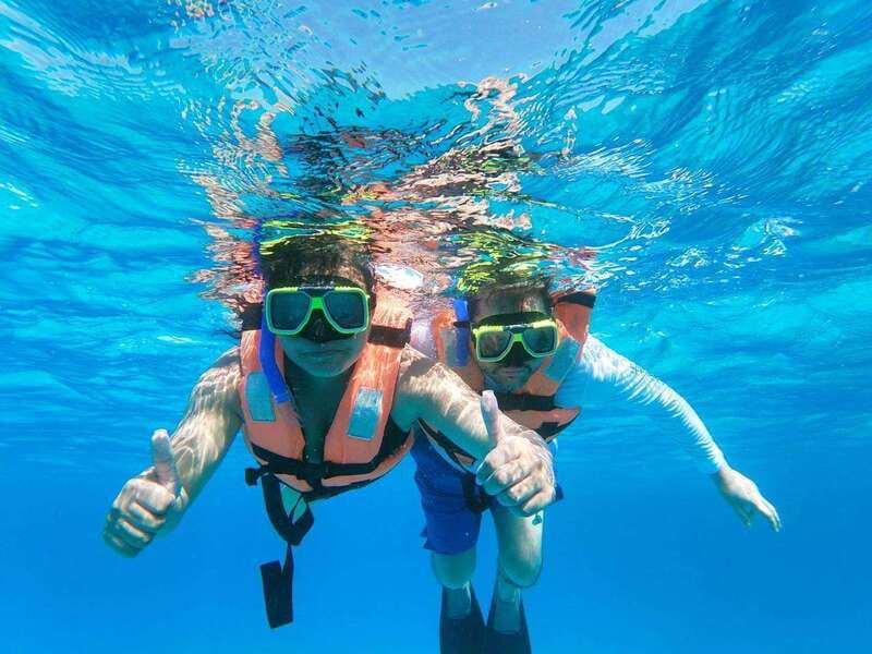 Isla Mujeres: Catamaran with Open Bar, Snorkeling and Lunch - Sailing south with music, drinks, and open-bar limits