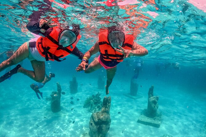 Isla Mujeres Spring Break Party Catamaran Snorkel and Open Bar - Setting out from Playa Tortugas at 10:30 am