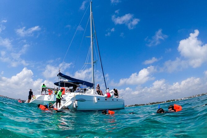 Isla Mujeres Tour on Catamaran with Snorkel, Open Bar, Buffet & Beach club - Arriving on Isla Mujeres