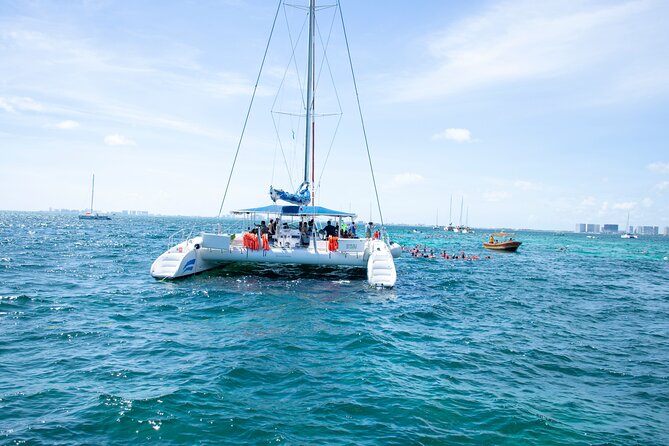 Isla Mujeres Tour on Catamaran with Snorkel, Open Bar, Buffet & Beach club - Lunch, drinks, and the beach club