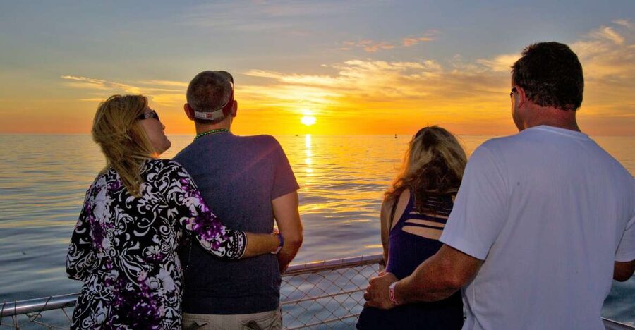 Key West Signature Sunset Cruise with Open Bar, Food & Music - Leaving the Key West seaport for open water
