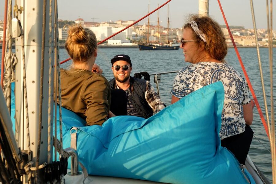 Lisbon: City Skyline Sailboat Cruise with Drink and Snacks - Sunset departures and changing weather