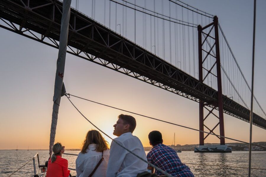 Lisbon: Daytime/Sunset/Night City Sailboat Tour with Drink - Commerce Square, Baixa, and the castle above Alfama