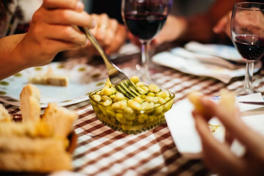 Lisbon: Private Evening Tour with Drinks & Bites in Alfama - The second stop: a closer taste of local habits