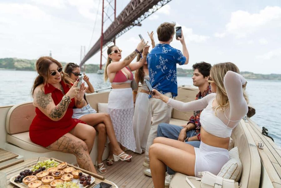 Lisbon: Relax in the Waves - Open Bar and Snacks at Sunset - A sunset view of Lisbon from the Tejo