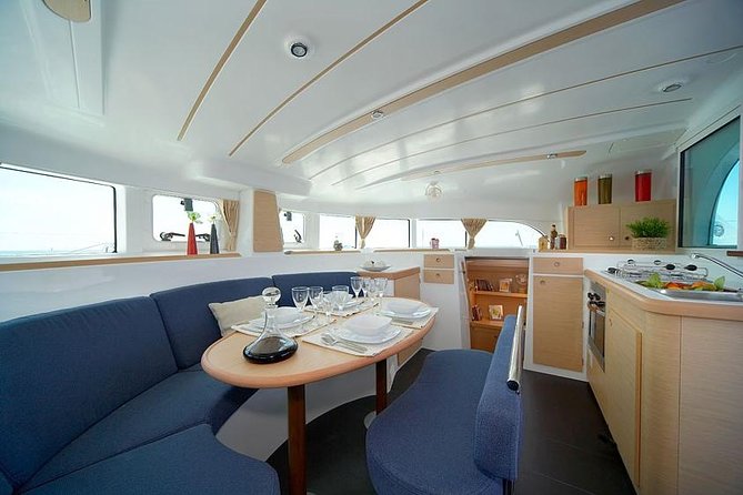 Lisbon Sailing Catamaran Public Cruise with drinks - Under the 25 de Abril Bridge